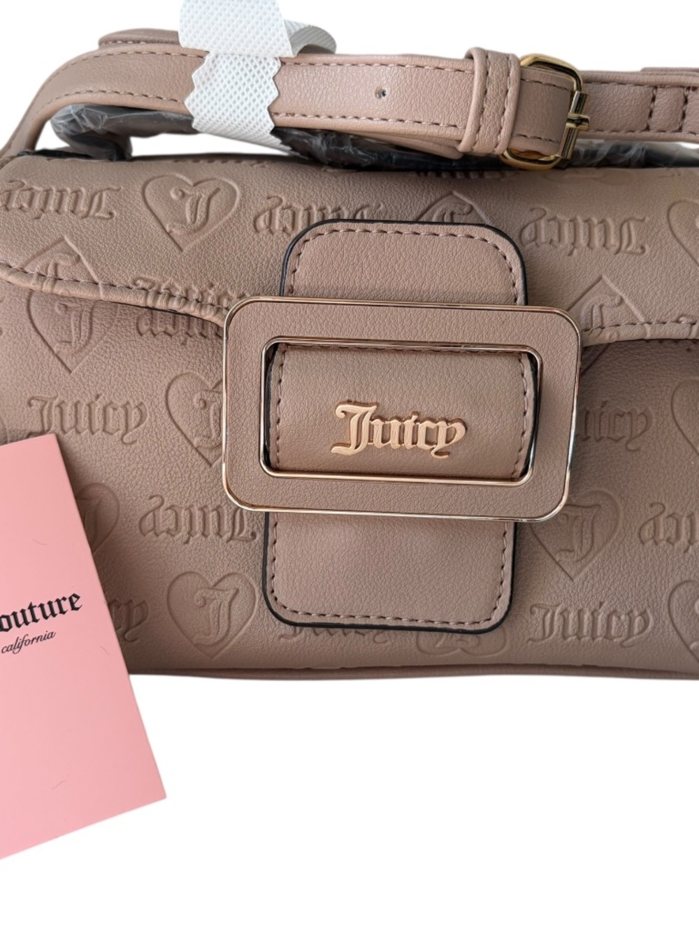 Juicy Couture monogram crossbody bag features an embossed logo